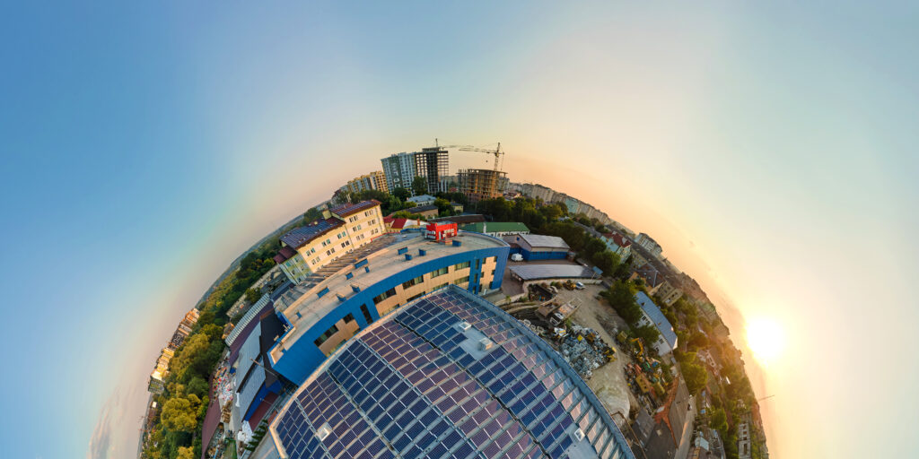 Little planet with big sustainable electric power plant with many rows of solar photovoltaic panels for producing clean ecological electrical energy. Renewable electricity with zero emission concept.